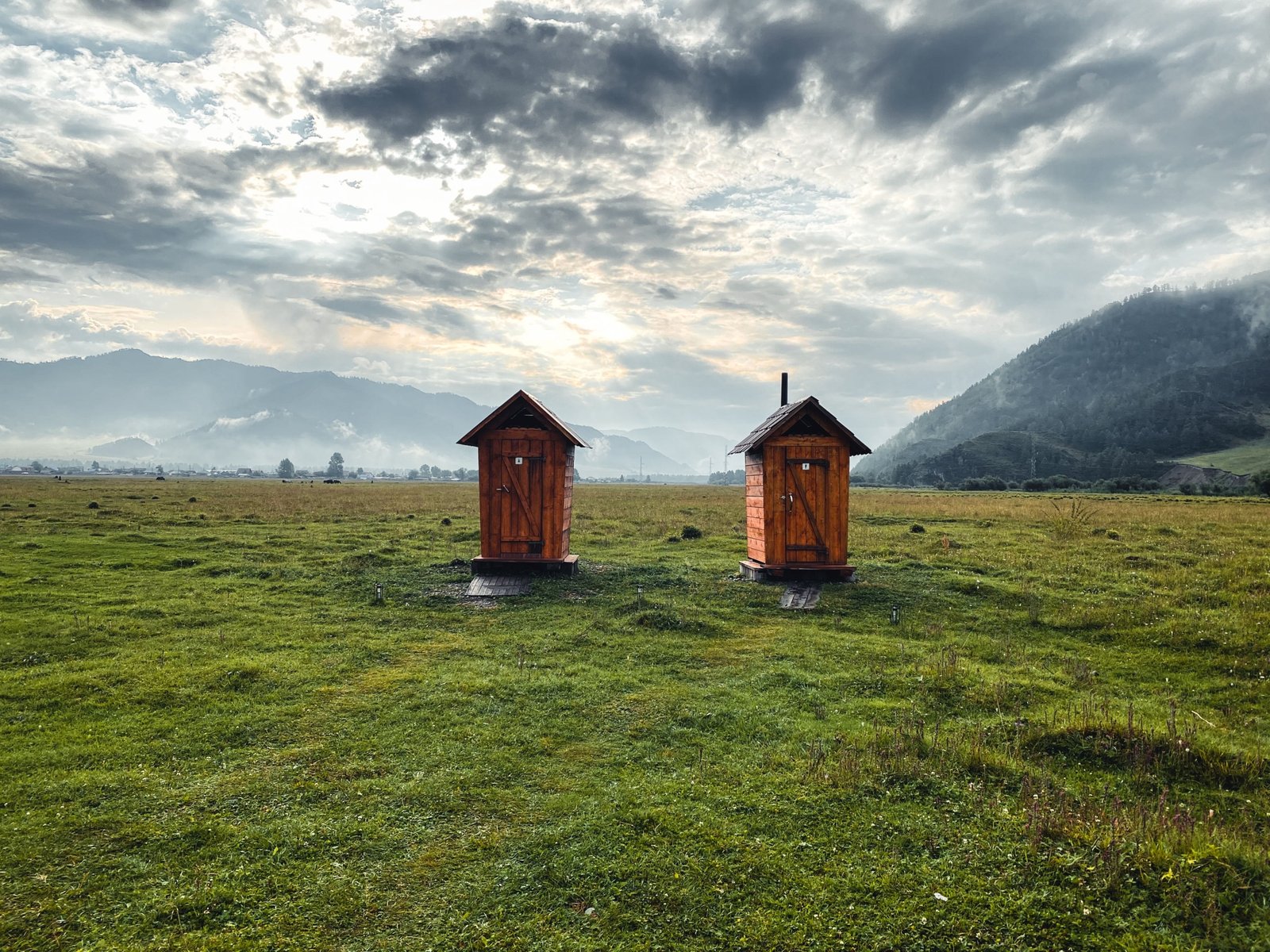 Portable camping toilet in natural outdoor setting for hygienic travel and adventure
