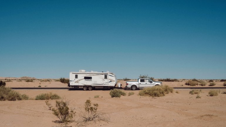 Rockwood 2516S travel trailer being towed on a highway showing full length including hitch