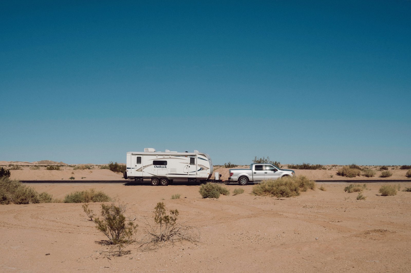Rockwood 2516S travel trailer being towed on a highway showing full length including hitch