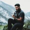 Lightweight carbon fiber travel guitar outdoors showing portability and durability for musicians on the go
