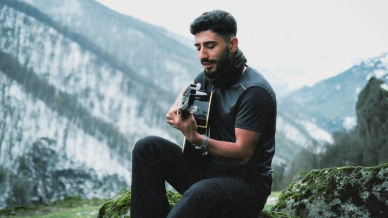 Lightweight carbon fiber travel guitar outdoors showing portability and durability for musicians on the go