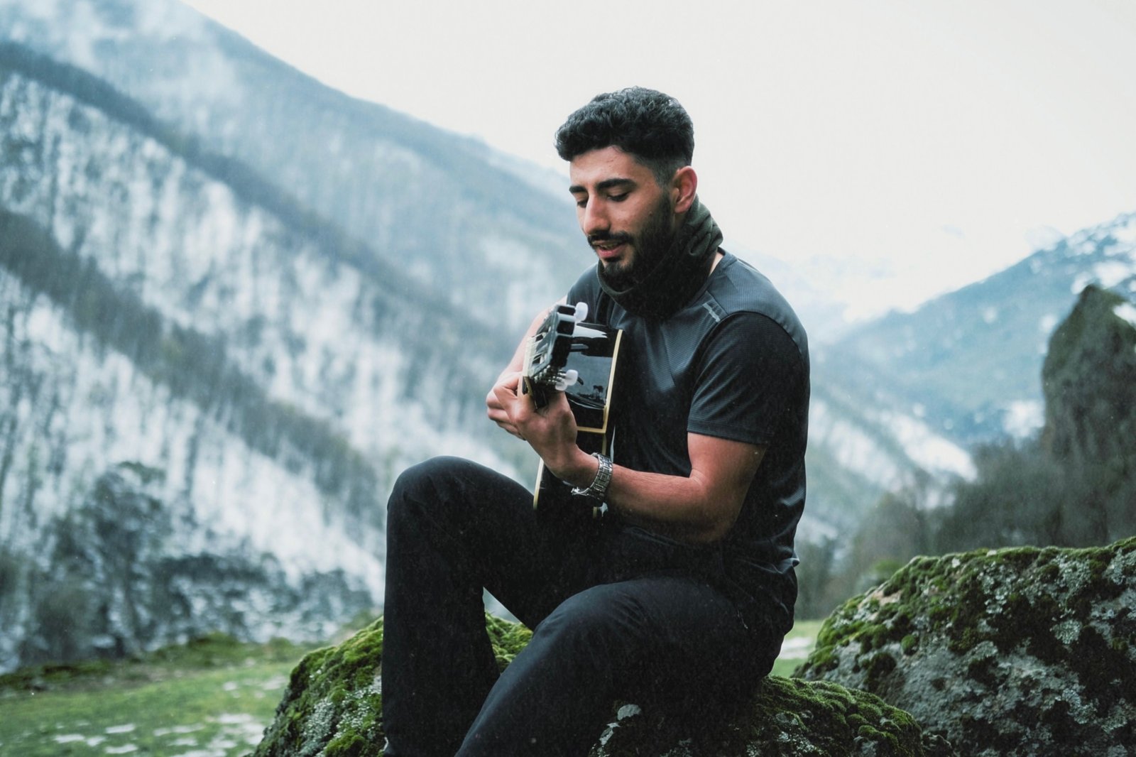 Lightweight carbon fiber travel guitar outdoors showing portability and durability for musicians on the go