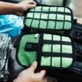 Organized suitcase with colorful travel packing cubes and toiletry bags for efficient and stress-free packing