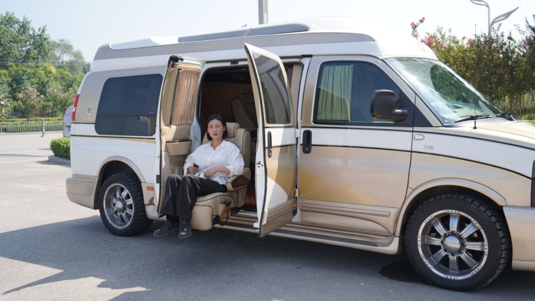 Compact and functional travel van bathroom interior with toilet and shower, illustrating comfort and convenience for road trips