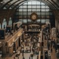 Visitors exploring art exhibitions in a famous Paris museum showcasing classic and modern artworks in 2023