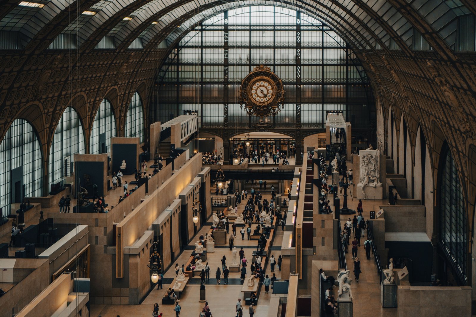 Visitors exploring art exhibitions in a famous Paris museum showcasing classic and modern artworks in 2023