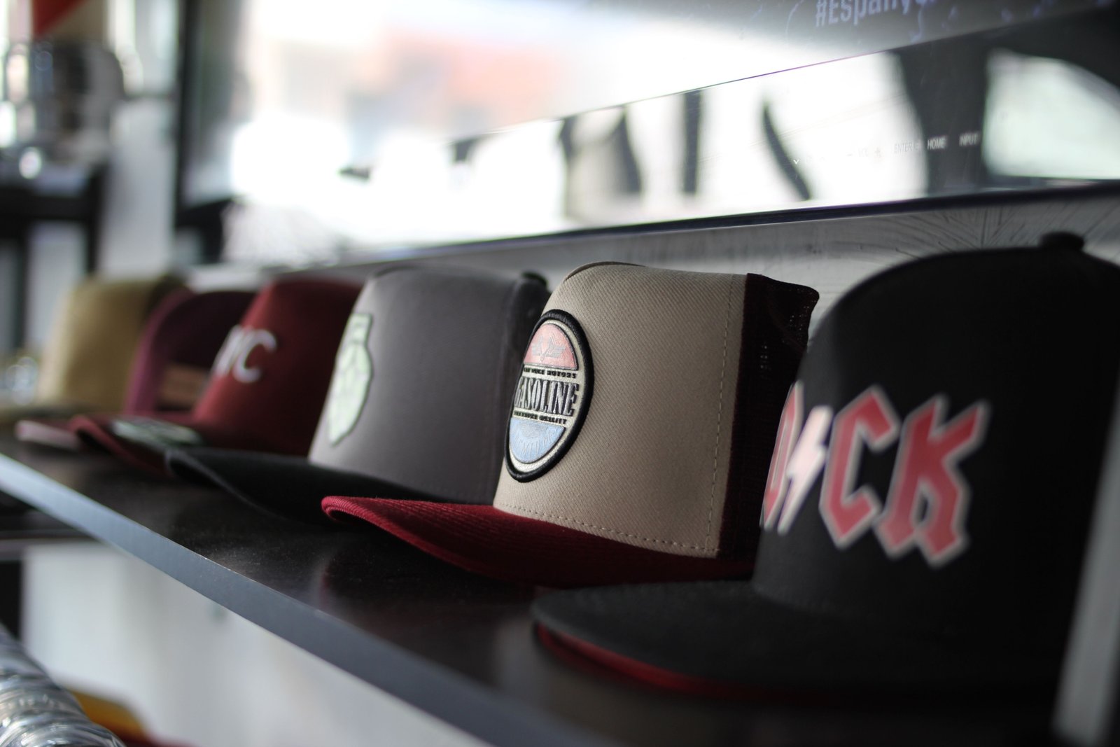 Baseball hats neatly organized inside a hard shell travel case for protection during travel
