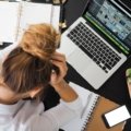 Frustrated person troubleshooting software issue on computer to fix EndNote export dialog problem
