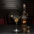 Premium Travelers Club Vodka bottle with travel-themed props representing elegance and global heritage
