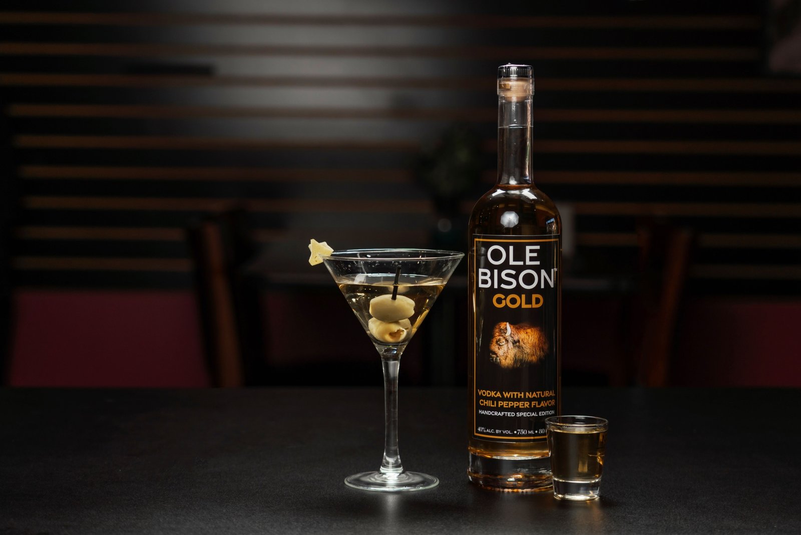Premium Travelers Club Vodka bottle with travel-themed props representing elegance and global heritage