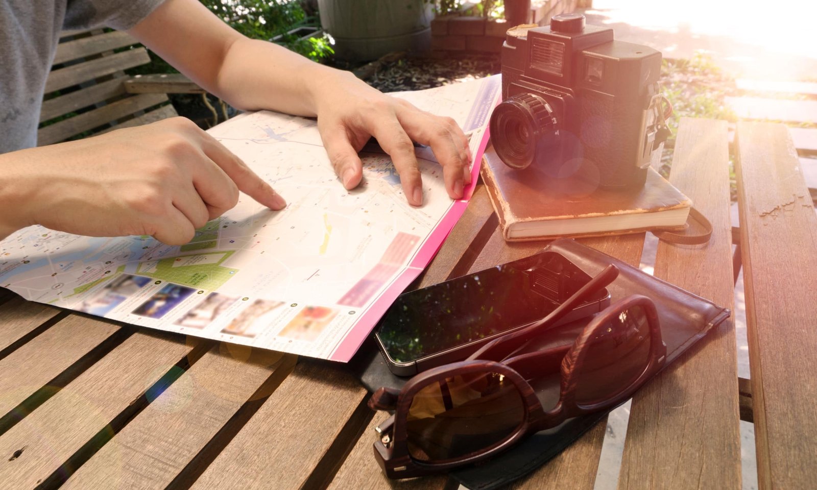 Close-up of Los Angeles travel guide book and map for trip planning with iconic cityscape background