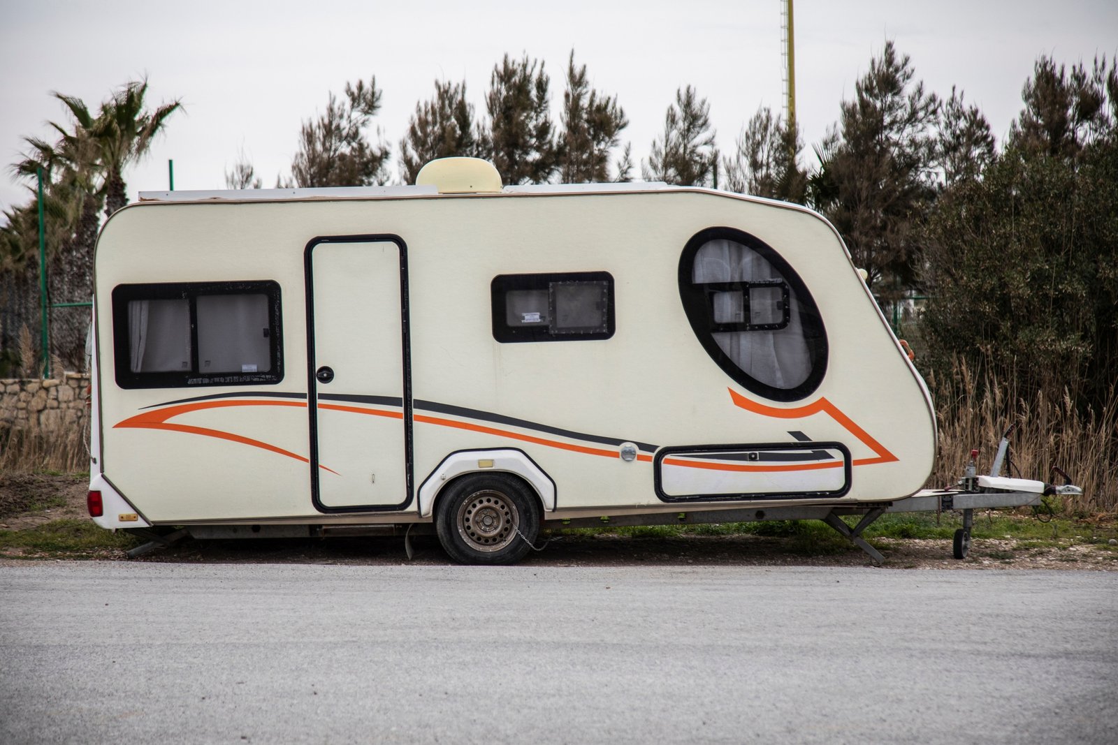 Gulfstream travel trailer parked outdoors surrounded by nature, highlighting comfort and reliable design for road adventures
