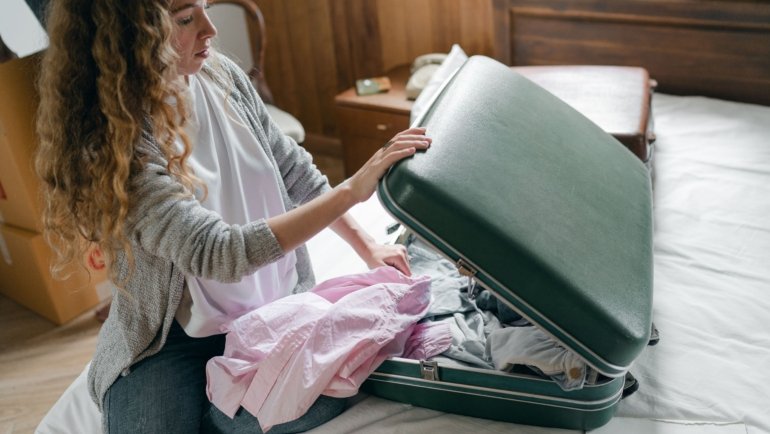Traveler packing lightweight travel clothes for versatile and comfortable adventures