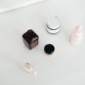 Travel size Skinceuticals skincare products neatly organized in a clear toiletry bag for convenient and portable skincare routine while traveling