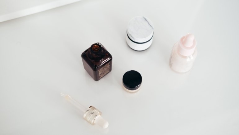 Travel size Skinceuticals skincare products neatly organized in a clear toiletry bag for convenient and portable skincare routine while traveling
