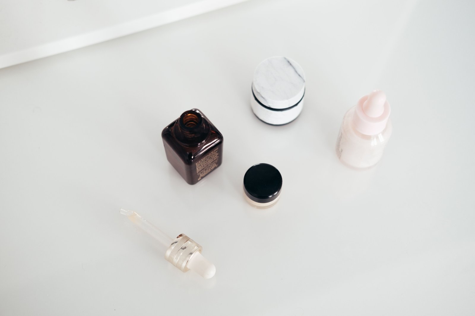 Travel size Skinceuticals skincare products neatly organized in a clear toiletry bag for convenient and portable skincare routine while traveling