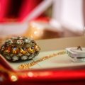 Luxury travel jewelry case open with compartments holding necklaces, rings, and bracelets on a soft velvet interior