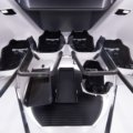Interior of a luxury spacecraft cabin with panoramic views of Earth orbit for commercial space tourism