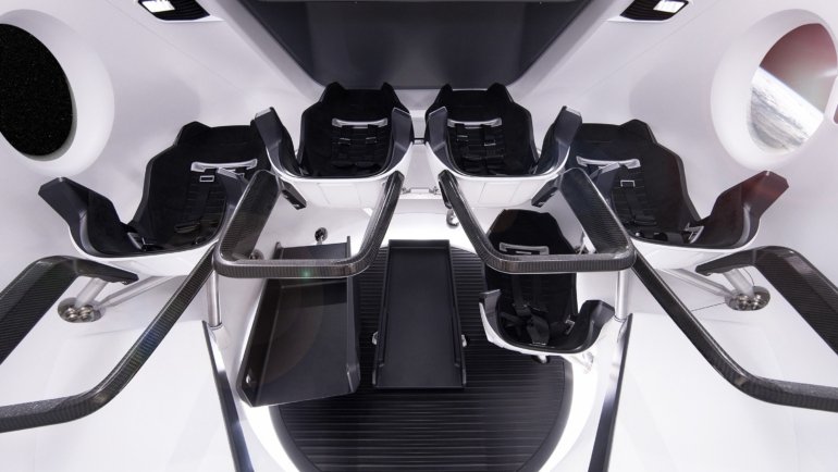 Interior of a luxury spacecraft cabin with panoramic views of Earth orbit for commercial space tourism