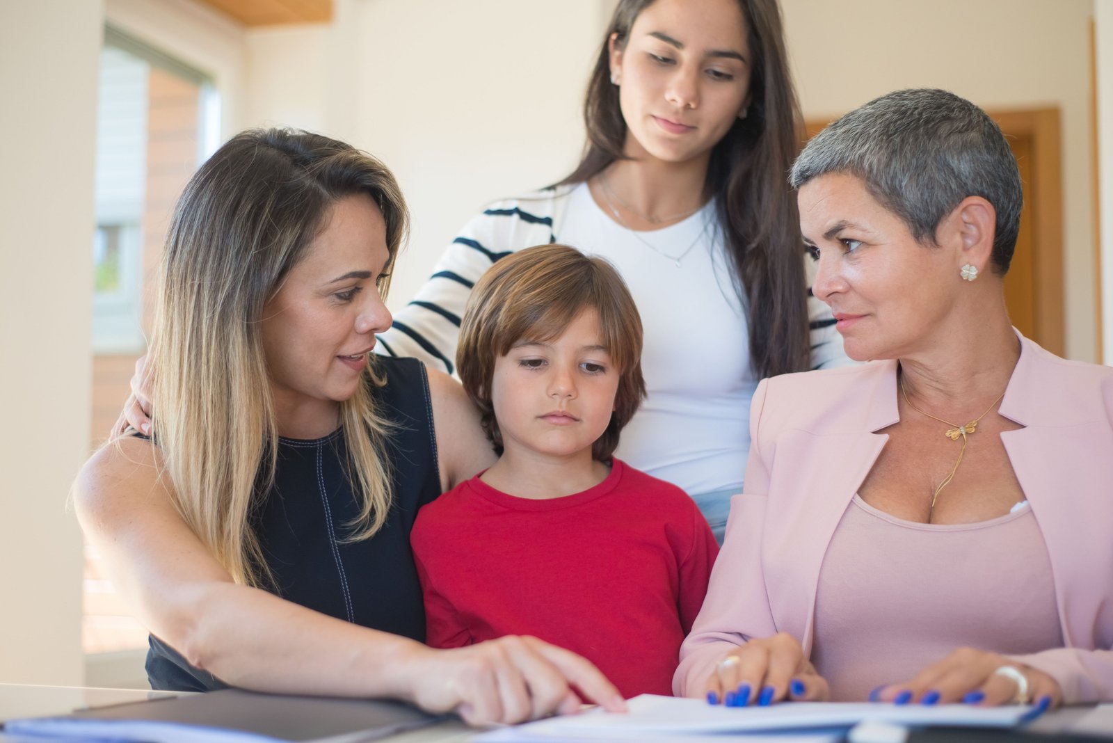 Travel agent helping family plan a magical Disney vacation with smiles and Disney brochures