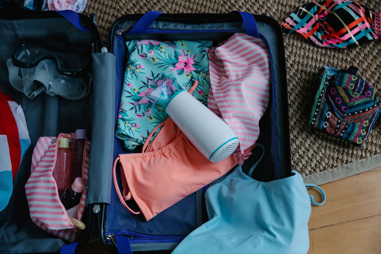 Compact travel pump bottle being packed into luggage for organized and hygienic travel