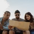 Diverse group of travelers engaged in planning unique adventures representing various travel personalities and styles