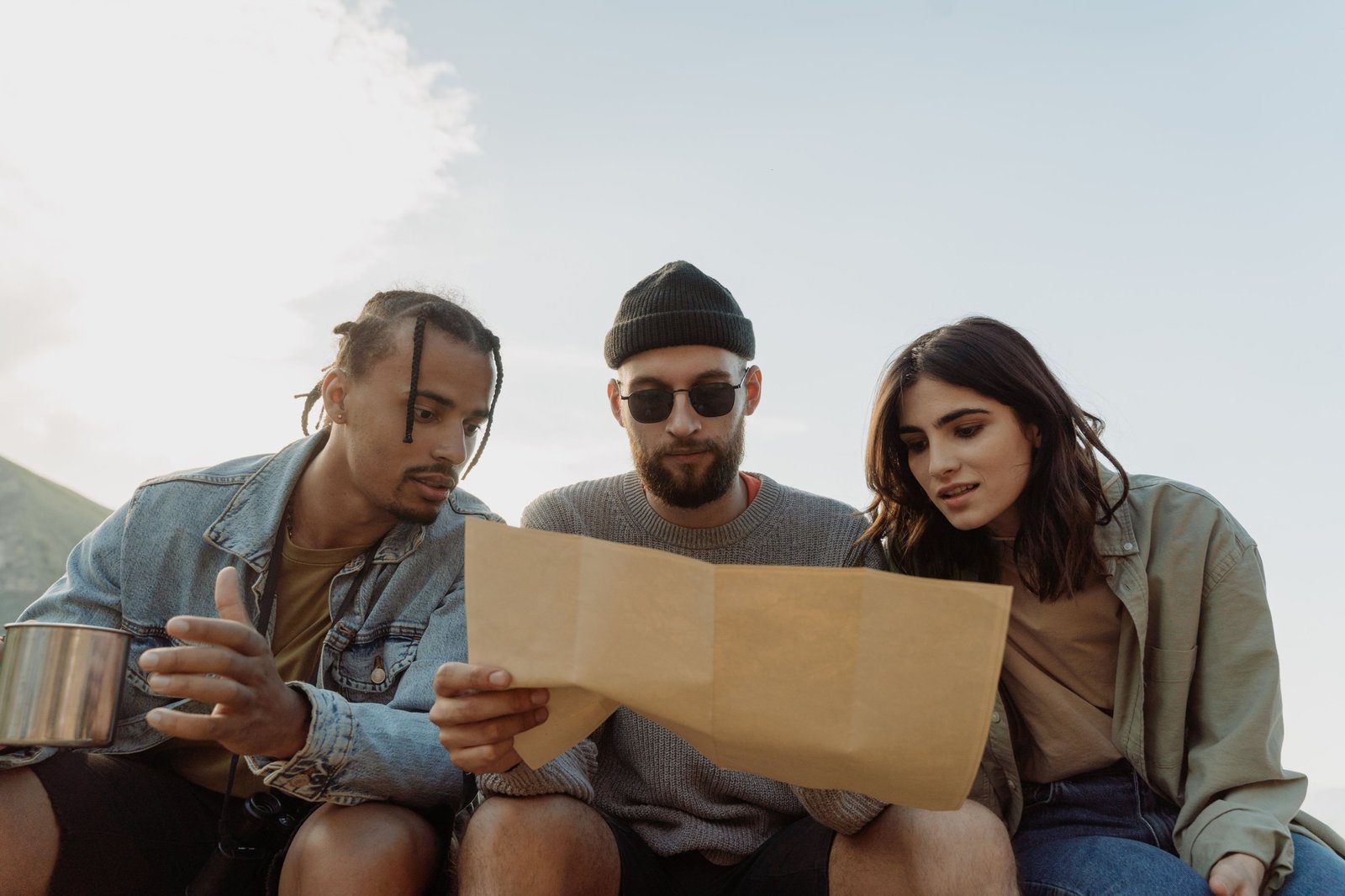 Diverse group of travelers engaged in planning unique adventures representing various travel personalities and styles