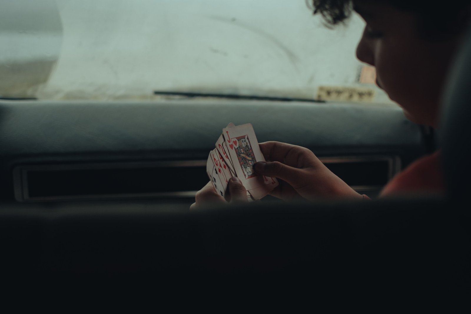Group of travelers playing portable board and card games during a road trip to pass time and enjoy entertainment