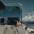 Motorboat cruising on calm sea with GPS navigation system for accurate travel time calculation