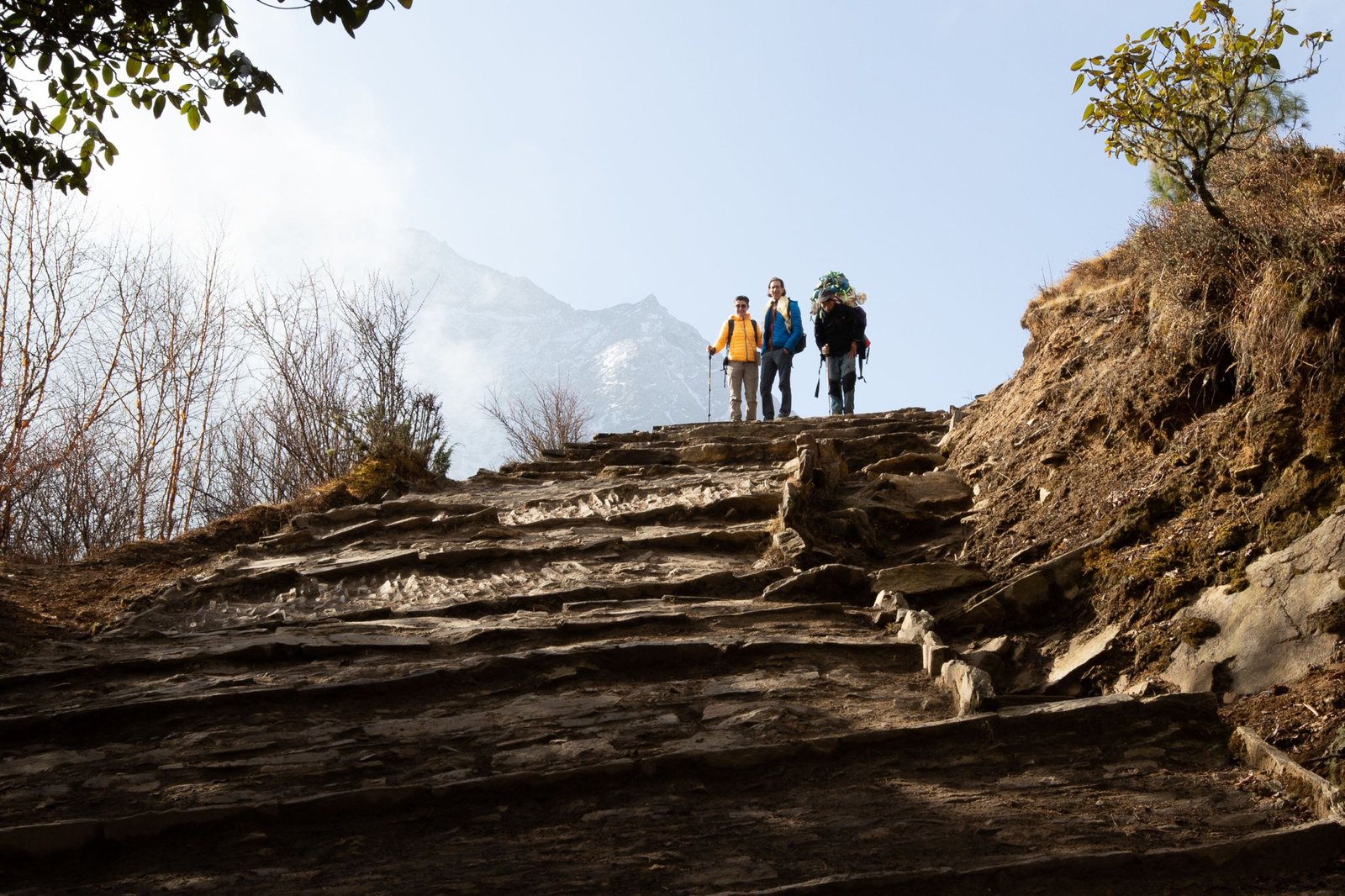 Trekking in Nepal Himalayas during autumn season with clear skies and vibrant mountain views