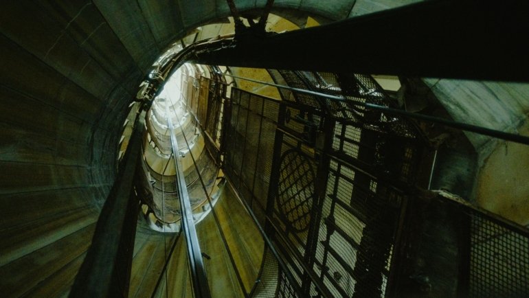 Close-up of durable elevator traveling cable inside elevator shaft demonstrating flexibility and safety features