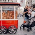 Family traveling with a toddler in stroller enjoying a safe and child-friendly outdoor destination