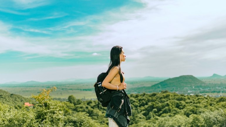 Lightweight minimalist travel backpack in nature representing simplicity and ease of travel