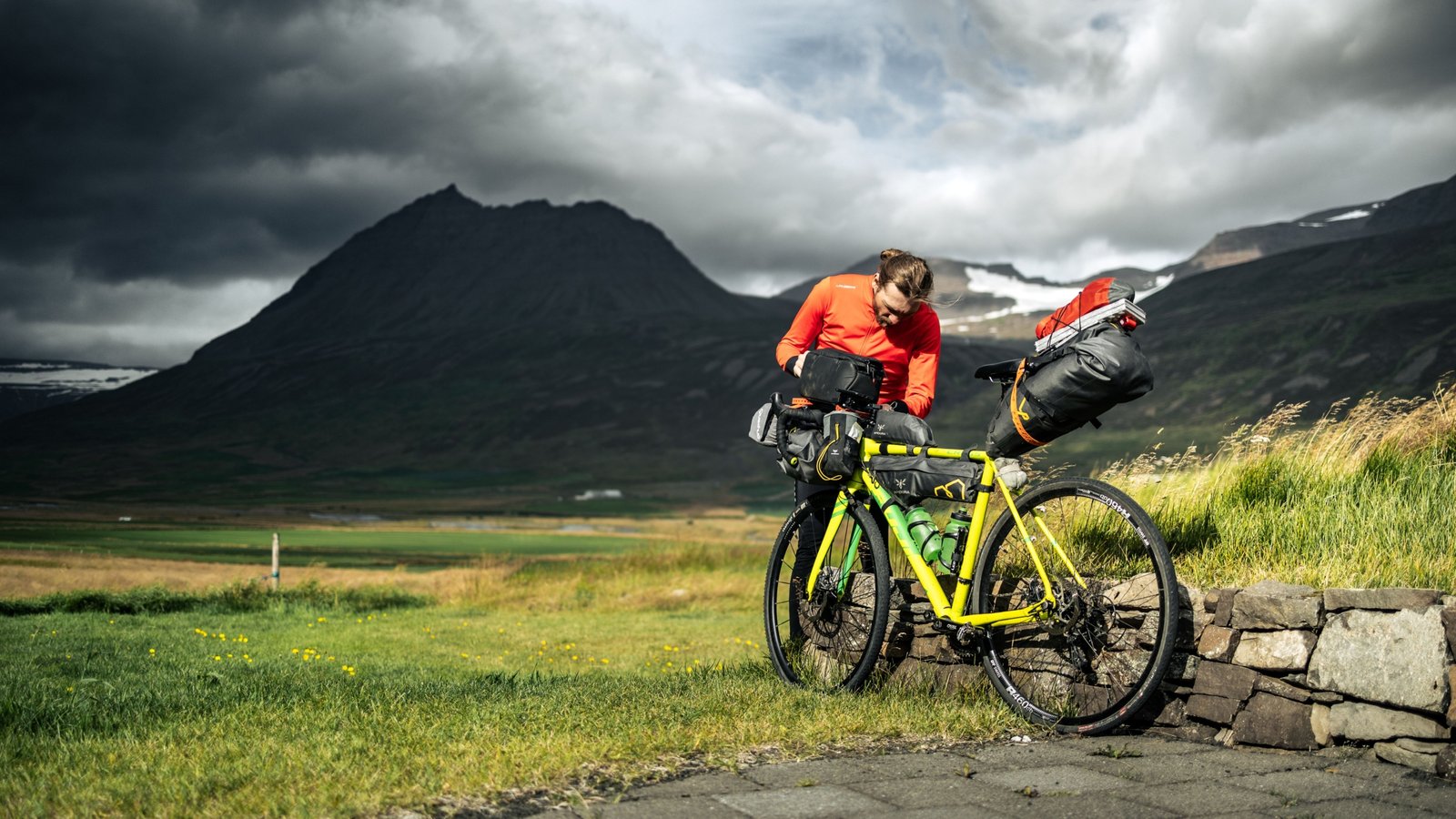 Cyclist packing bike into a protective EVOC travel case ready for secure transportation