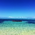 Crystal clear blue ocean waters at a peaceful beach showcasing natural beauty and tranquility for blue travel destinations