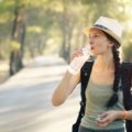 traveler practicing intermittent fasting while staying hydrated on a journey