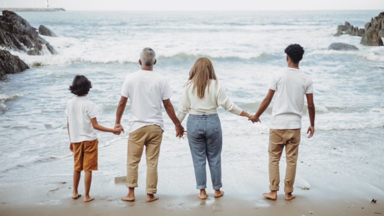 happy family with teenagers exploring nature and culture on a travel adventure