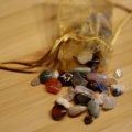 Travel pouch with protective and calming crystals on natural surface for peaceful and mindful travel