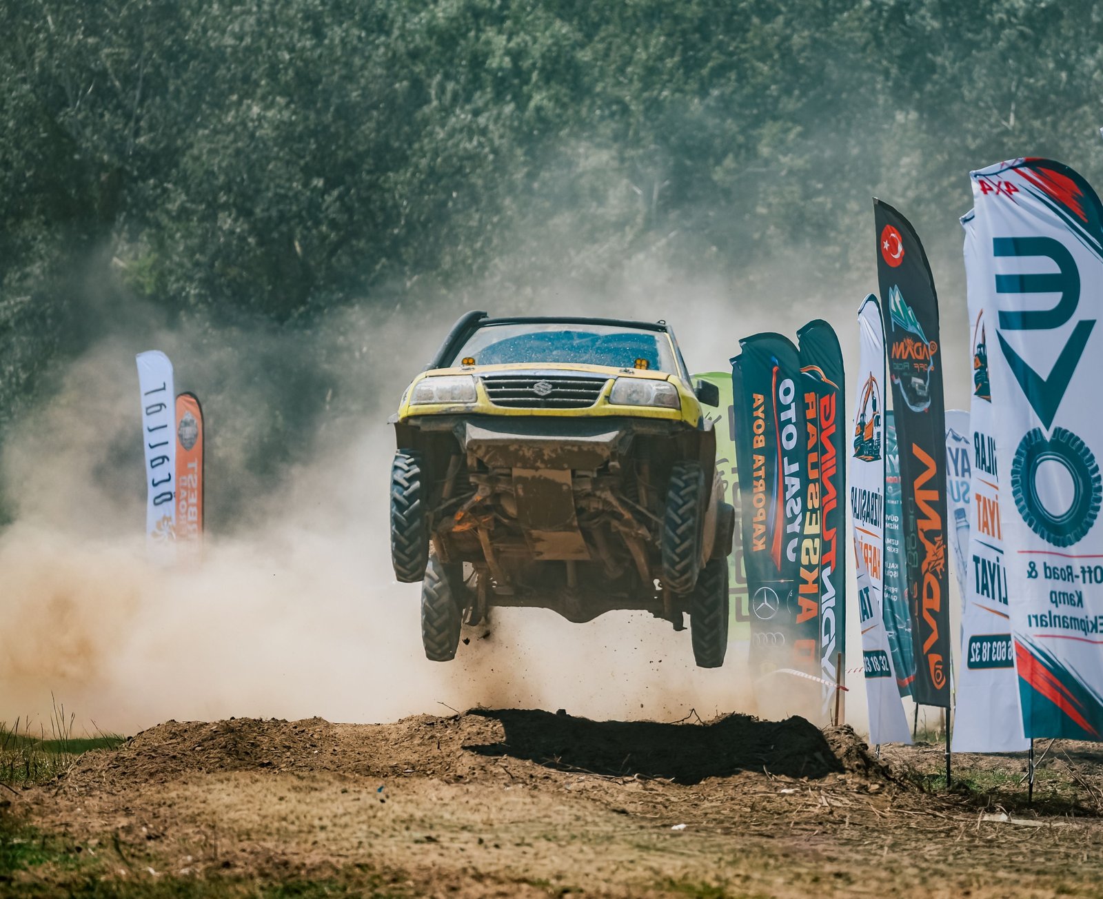 Close-up of long travel shock absorber on an off-road vehicle tackling rocky terrain for improved suspension and ride quality