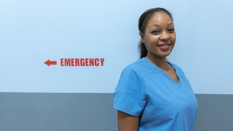 Emergency room nurse in Kansas City hospital providing care during busy shift for travel nursing assignment