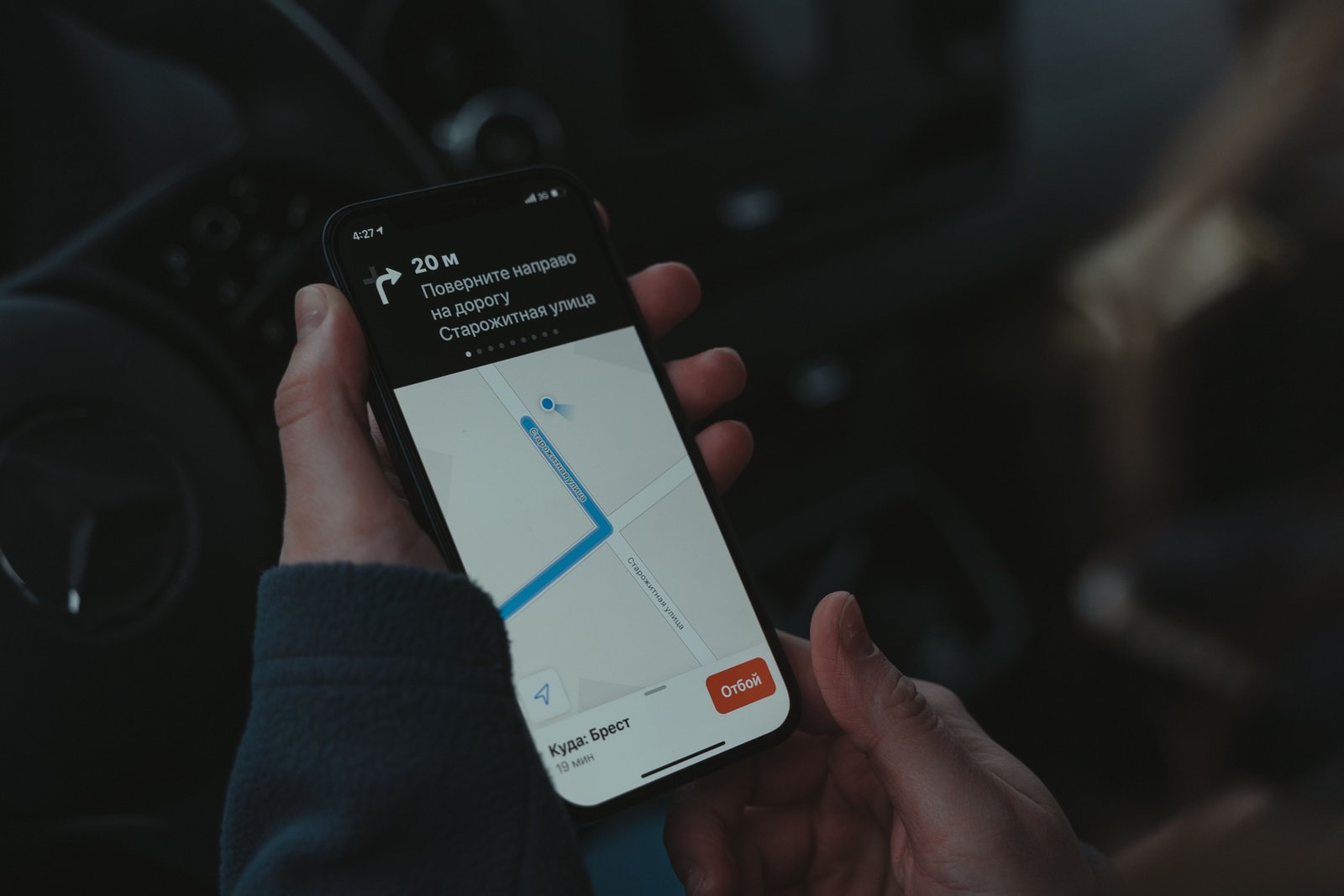 Business employee using GPS tracking on smartphone for travel safety and location monitoring