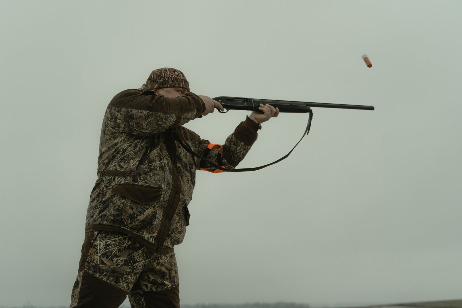 Shotgun shooting bird shot pellets outdoors demonstrating effective hunting range and pellet spread