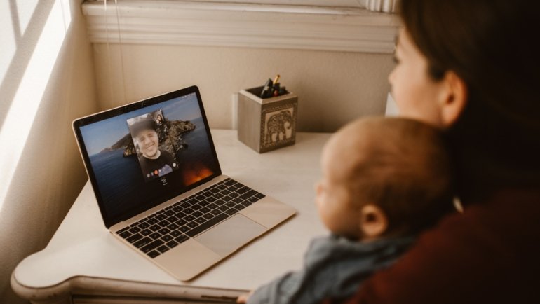Traveler having a video call with family while feeling homesick and missing loved ones during a journey