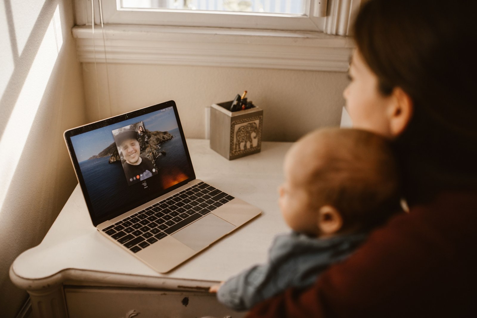 Traveler having a video call with family while feeling homesick and missing loved ones during a journey