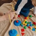 Happy children playing with travel toys during a family trip to stay entertained and engaged