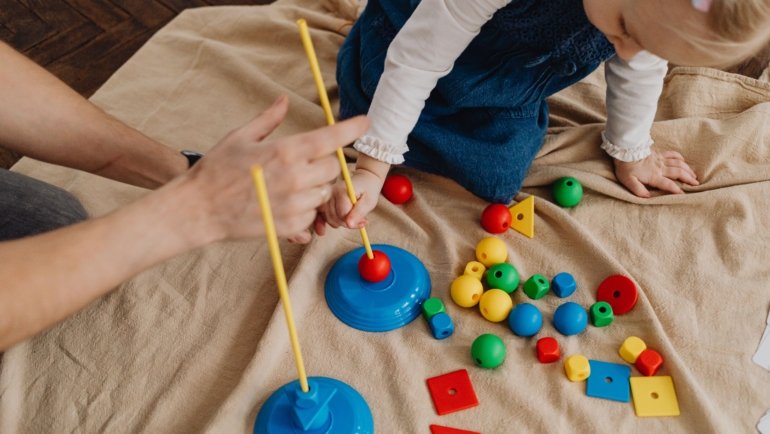 Happy children playing with travel toys during a family trip to stay entertained and engaged