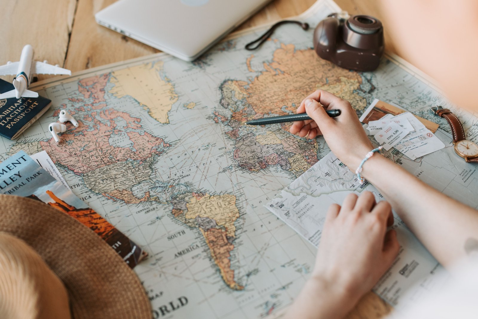 Travel agent helping customer plan trip with flight and hotel booking at travel center