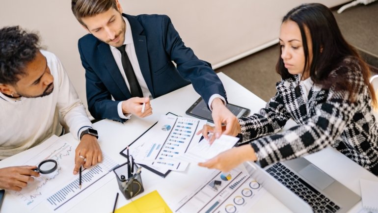 Corporate travel team planning business trip logistics and managing corporate travel efficiently