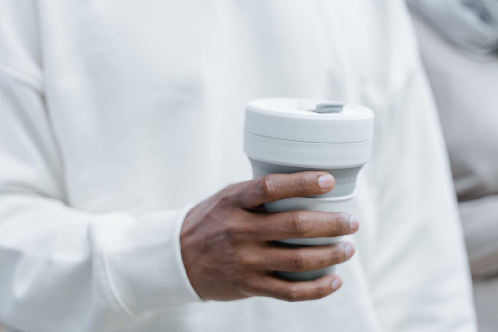 Folding travel cup collapsing and expanding, perfect for eco-friendly and portable hydration on the go