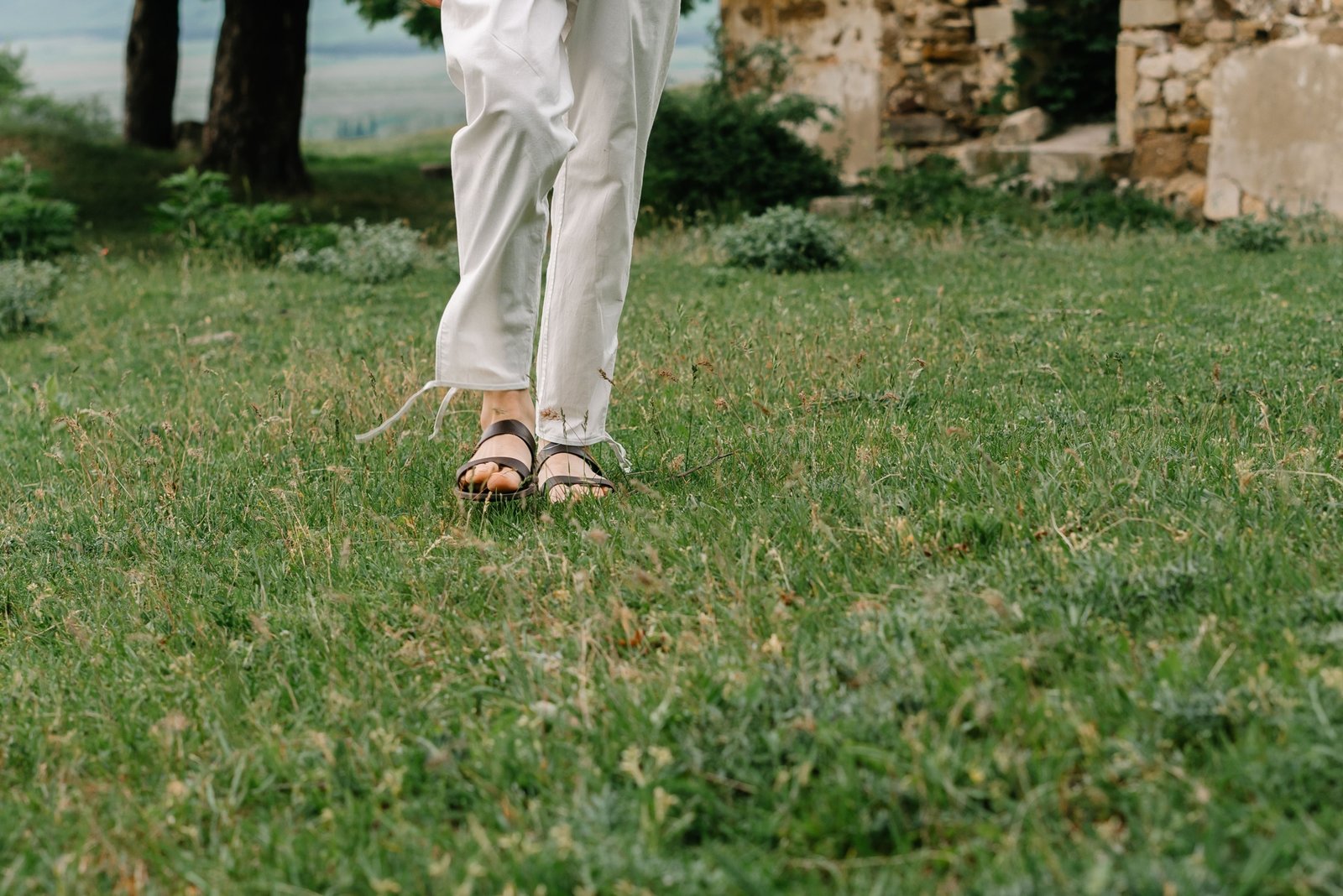 Traveler wearing breathable lightweight travel pants outdoors for comfort and mobility